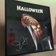 A copy of Halloween on LaserDisc, signed by John Carpenter